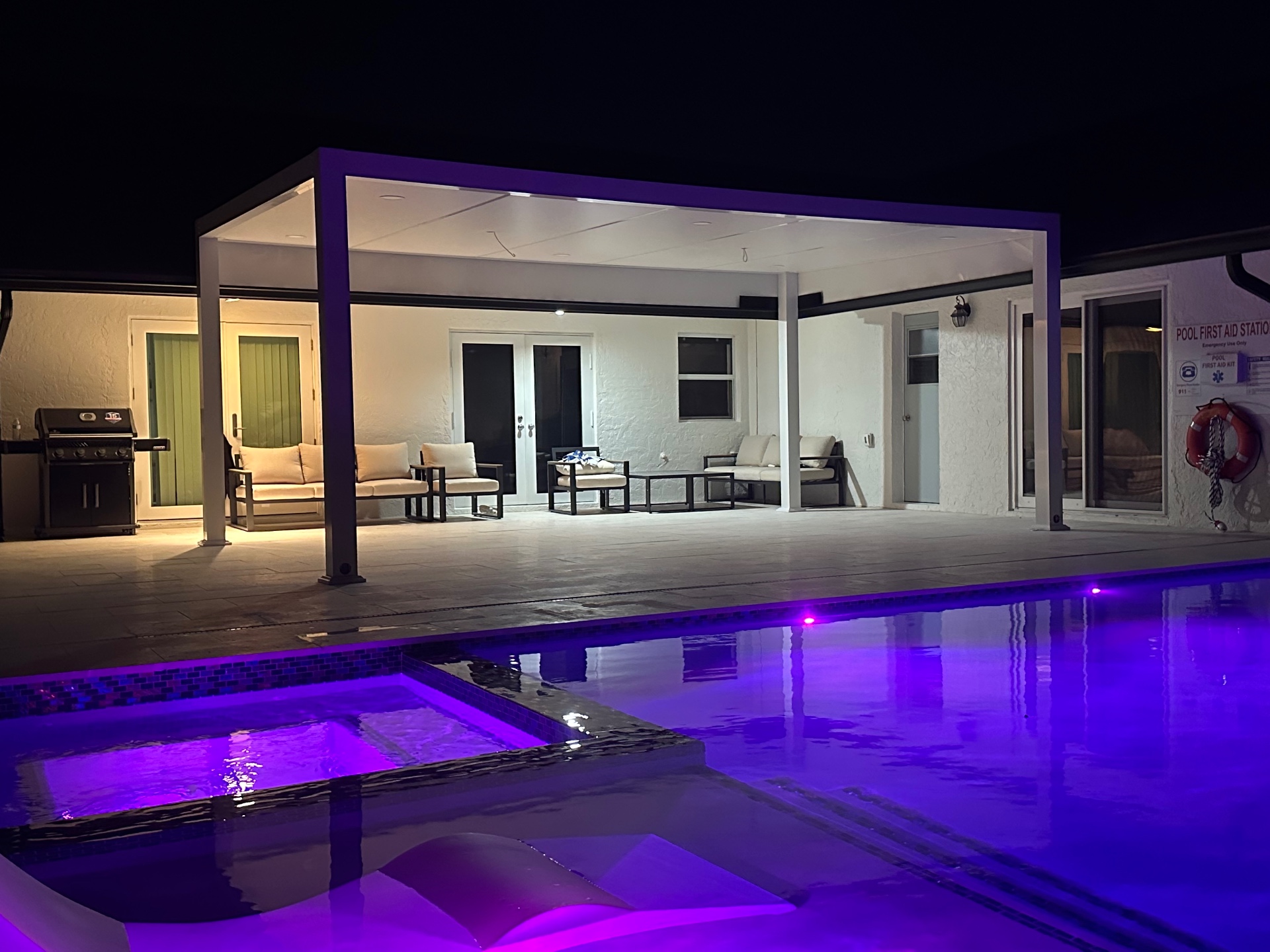 Neon-Lit Poolside Pergola at Night